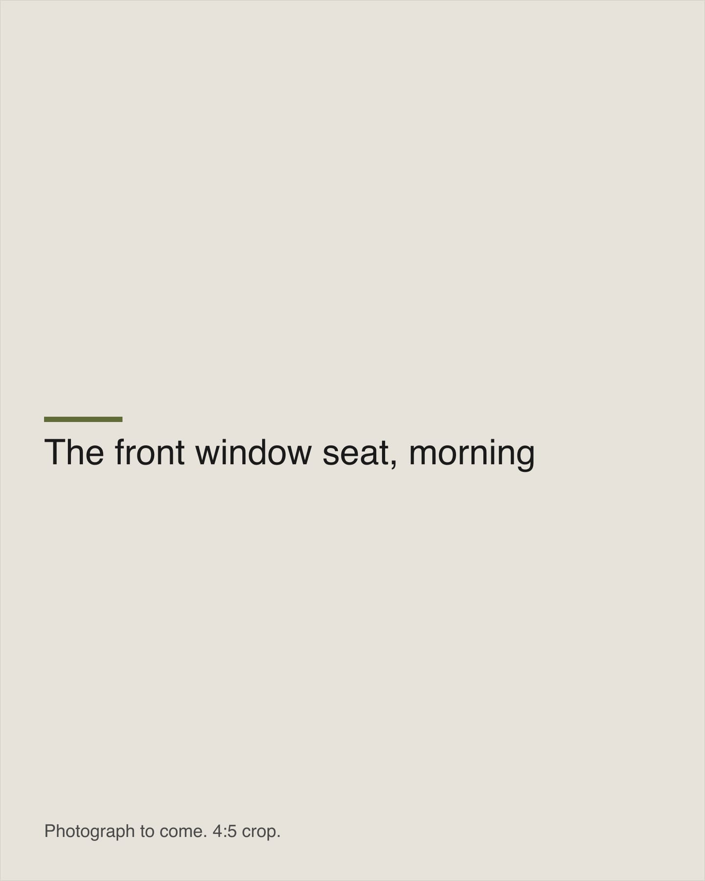 The window seat at the front of the room in morning light.