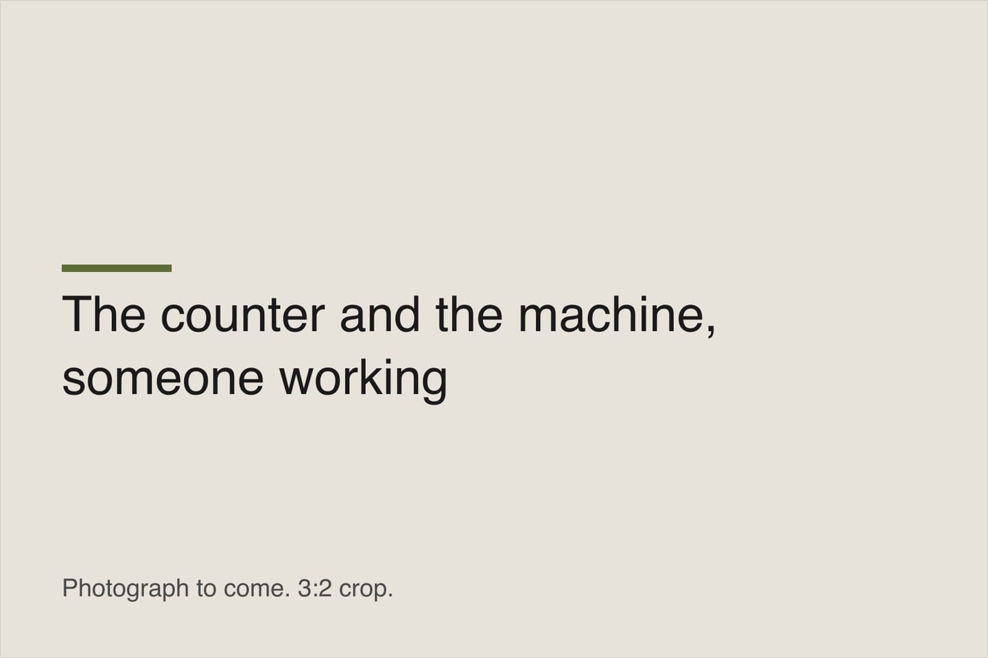 A staff member working behind the counter at the coffee machine.